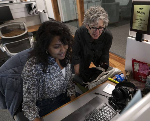 Jill Kaufman, a reporter with New England Public Media, edits a story with Nirvani Williams in Springfield. The Trump administration on May 1 issued an executive order that calls for funding cuts to the Corporation for Public Broadcasting, which includes National Public Radio and The Public Broadcasting Service.