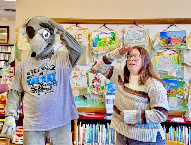 Paddles and Moore-Leland Library Children’s Librarian April Violette for a reading of “Pie Rats Ahoy” by Richard Scarry.