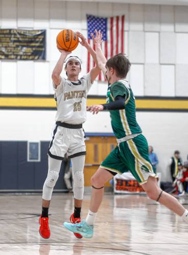 Pioneer’s Alex McClelland (15) takes a three-point shot against Ware in the third quarter of an MIAA Division 5 quarterfinal last week in Northfield.
