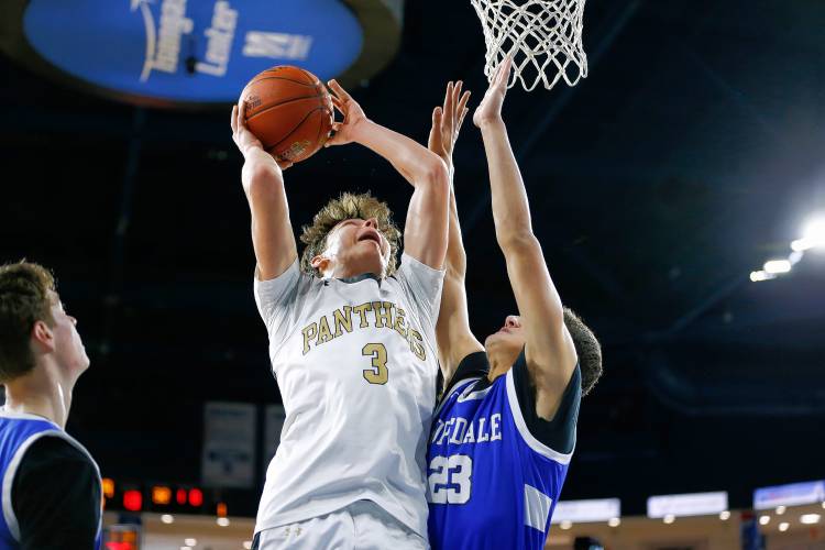 Pioneer’s Kurt Redeker (3) drives to the hoop over Hopedale’s Nate Rutkowski (23) in the second quarter of the MIAA Div. 5 state championship Saturday at the Tsongas Center in Lowell. 