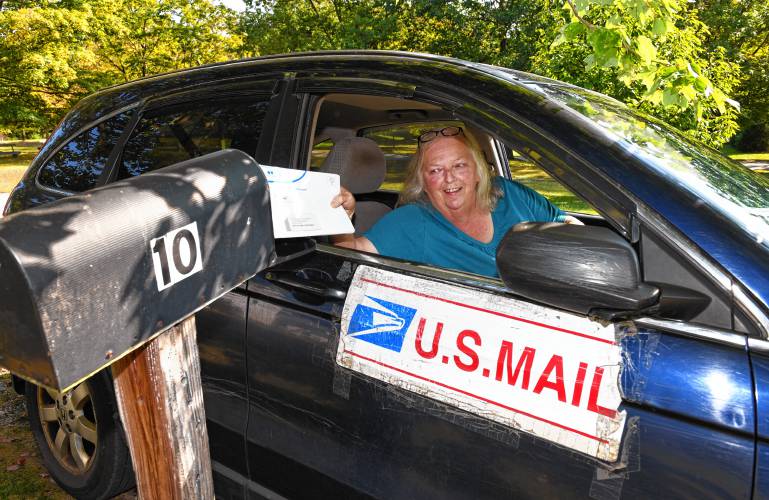 Wendy Flanders, delivering mail in New Salem, is retiring after 40 years. Her route includes about 225 stops in New Salem and a small portion of Orange.
