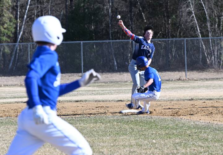Franklin Tech second baseman George Gutierrez fields the hit, steps on the base for the out at second and then attempts to throw out the runner at first at Franklin Tech on Tuesday. 