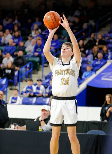 Pioneer’s Will Glazier (25) takes a shot against Hopedale in the second quarter of the MIAA Div. 5 state championship Saturday at the Tsongas Center in Lowell. 