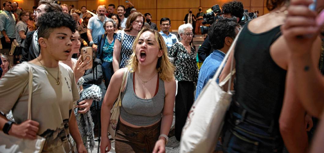 UMass students chant and yell as they leave Mahar Auditorium after a special Faculty Senate meeting on May 14 where Chancellor Javier Reyes defended the crackdown on student protesters on May 17, when 134 people were arrested. 