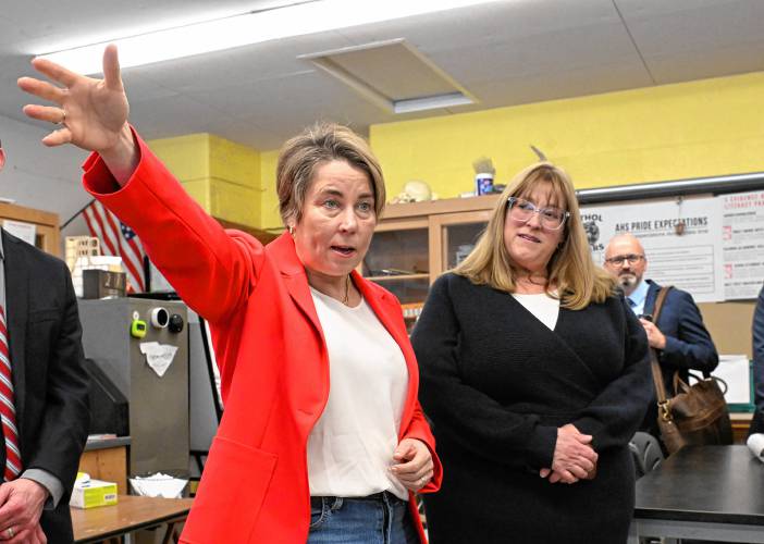 Massachusetts Gov. Maura Healey and state Rep. Susannah Whipps, I-Athol, talk to students at Athol High School on Thursday, when the governor was in town to announce funding for the school’s Career Pathways Program.