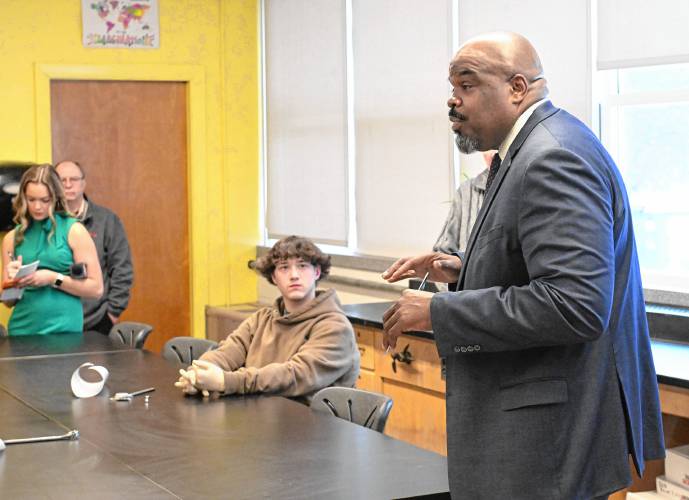 Massachusetts Secretary of Education Pat Tutwiler, right, talks with students in Matt Talbot’s precision measuring instruments class in Athol High School on Thursday.