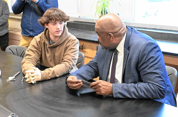 Massachusetts Secretary of Education Pat Tutwiler, right, talks with student Dakota Choquette in Matt Talbot’s precision measuring instruments class in Athol High School on Thursday.