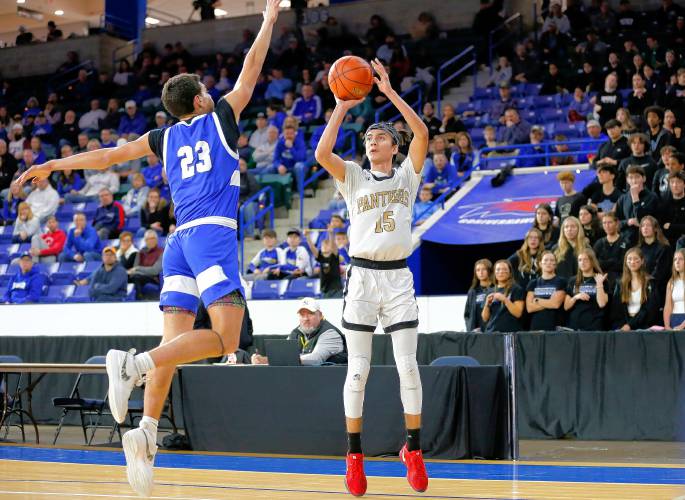 Pioneer’s Alex McClelland (15) takes a shot defended by Hopedale’s Nate Rutkowski (23) in the second quarter of the MIAA Div. 5 state championship Saturday at the Tsongas Center in Lowell. 