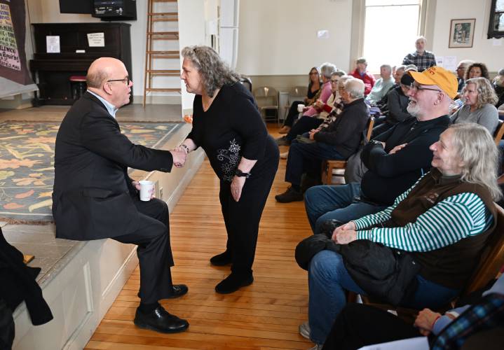 Shutesbury resident Louise Dunphy greets Congressman Jim McGovern at Whately Town Hall on Wednesday.