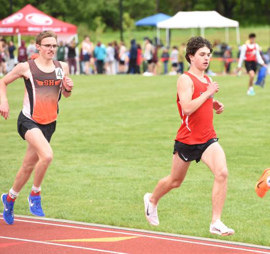 South Hadley’s Nathan Hutchinson, left, and Frontier’s Evan Hedlund, right, compete in the boys mile at the Division 2 Western Massachusetts championships at Mount Greylock Regional School on Saturday afternoon.