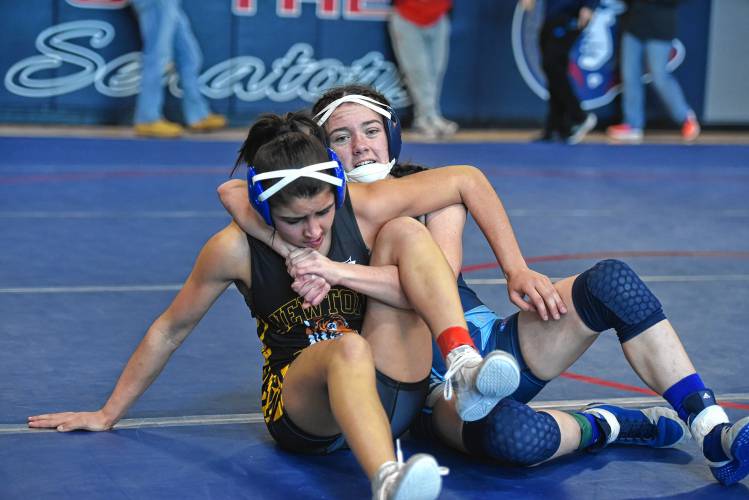 Franklin Tech's Mia Marigliano (right) competes against Newton’s Maddie Ngo in the Mahar Girls Wrestling Tournament on Monday in Orange.