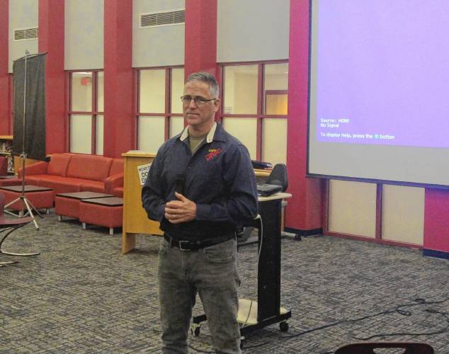 Retired Lt. Col. Glenn Scott, one of the instructors of Ralph C. Mahar Regional School’s Army Junior Reserve Officers’ Training Corps, listens to a member of the Mahar School Committee last week after talking about the potential of using air rifles.