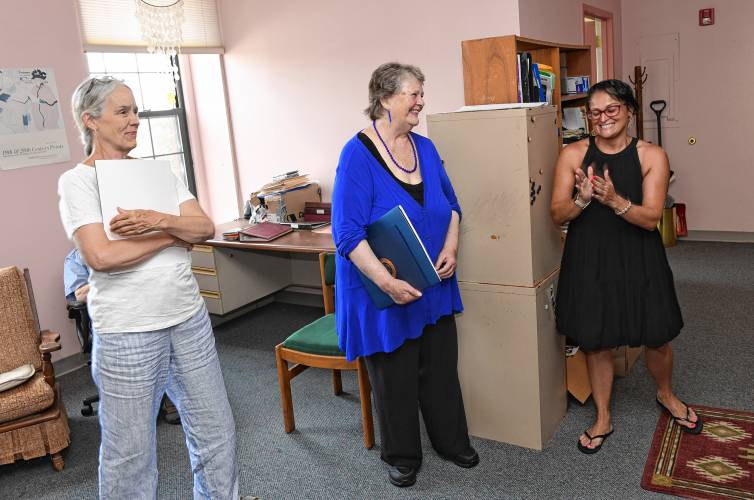 From left, Quabbin Mediation’s Training Director Susan Wallace and Executive Director Sharon Tracy, who are both retiring, are given citations from Eladia Romero of U.S. Rep. Jim McGovern’s office during a retirement celebration in Orange on Tuesday.