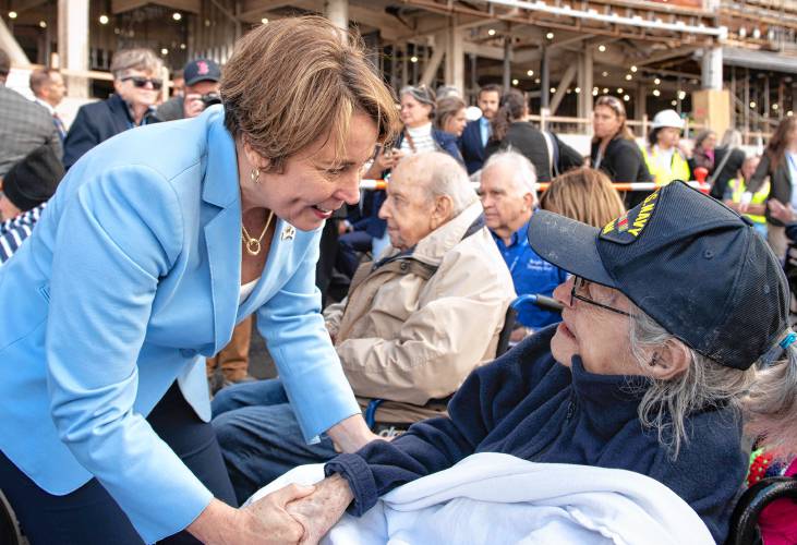 Gov. Maura Healey talks with Miriam Silverman, 100, a resident of the older building at the Veterans Home in Holyoke, during the ceremony for the facility on Thursday afternoon.