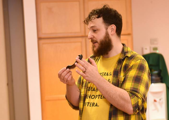  Bryan “Professor Bugman” Man holds an African giant millipede during the “Arthropod Petting Zoo” presentation at the Athol Public Library.
