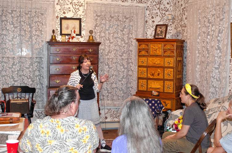 Ann Reed, a member of the Orange Historical Society, started the “Hear & Tell” event out of a desire to give space to local histories detailing paranormal encounters that might not be taken seriously elsewhere. Reed is pictured speaking during Friday’s second annual event. Ann Reed, a member of the Orange Historical Society, started the “Hear & Tell” event out of a desire to give space to local histories detailing paranormal encounters that might not be taken seriously elsewhere. Reed is pictured speaking during Friday’s second annual event.