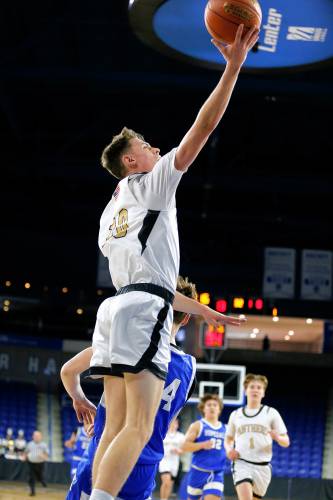 Pioneer’s Brayden Thayer (10) puts in a layup against Hopedale in the second quarter of the MIAA Div. 5 state championship Saturday at the Tsongas Center in Lowell. 
