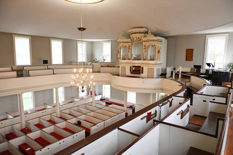 Stefan Maier has worked on this Richards & Fowkes pipe organ in the First Church of Deerfield.