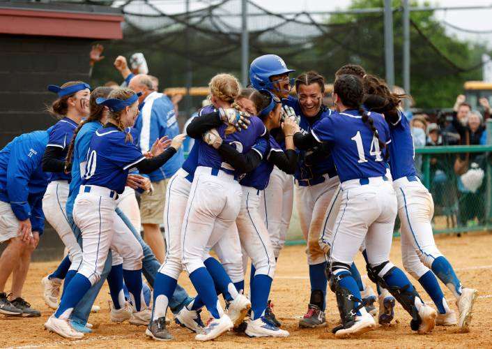 Turners Falls players celebrate after defeating Greenfield 2-1 in the bottom of the tenth inning to win the MIAA Division 5 softball state championship Saturday at UMass.