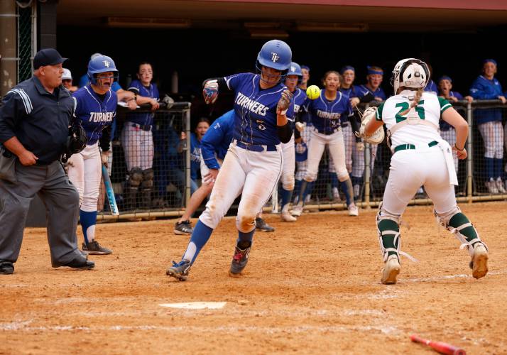 Turners Falls baserunner Madi Liimatainen (5) scores the game winning-run against Greenfield in the bottom of the tenth inning Saturday during the MIAA Division 5 softball state championship at UMass.