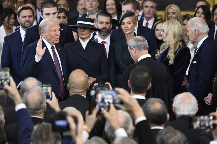 President-elect Donald Trump takes the oath of office during the 60th Presidential Inauguration in the Rotunda of the U.S. Capitol in Washington, Monday, Jan. 20, 2025.