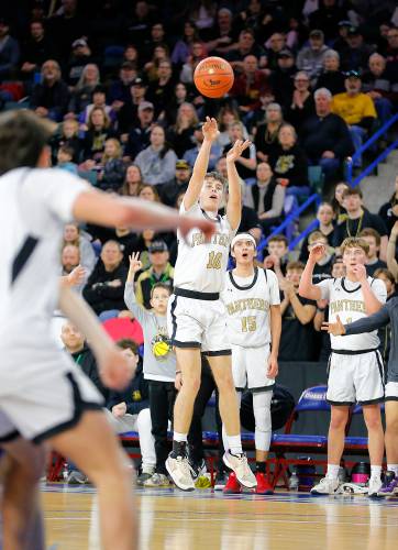 Pioneer’s Brayden Thayer (10) hits a three-pointer against Hopedale in the third quarter of the MIAA Div. 5 state championship Saturday at the Tsongas Center in Lowell. 