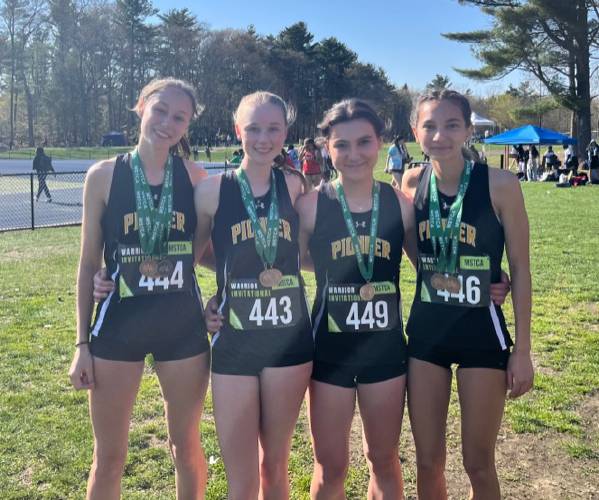 From left to right: The Pioneer girls 4x100 team of Louise Flageolet, Emmanuelle Flagollet, Dani Teaca and Sahana Heilman after setting the Panther school record in the event on Thursday in Foxboro. 