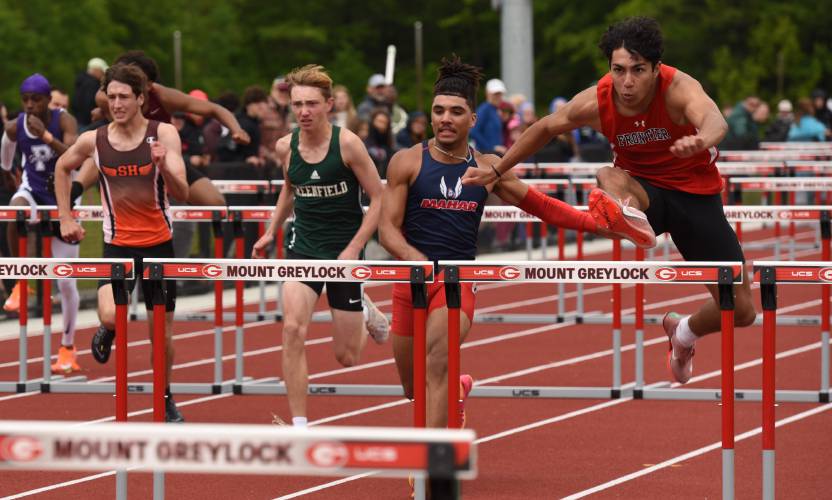 Frontier’s Ben Cachiguango, right, wins the boys 110 meter hurdles at the Division 2 Western Massachusetts championships at Mount Greylock Regional School on Saturday afternoon.