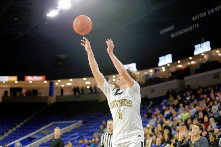 Pioneer’s Jackson Glazier (4) takes a shot against Hopedale in the fourth quarter of the MIAA Div. 5 state championship Saturday at the Tsongas Center in Lowell. 