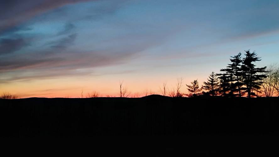 The sun sets behind the hills of North Quabbin, looking west from Chestnut Hill Avenue in Athol.