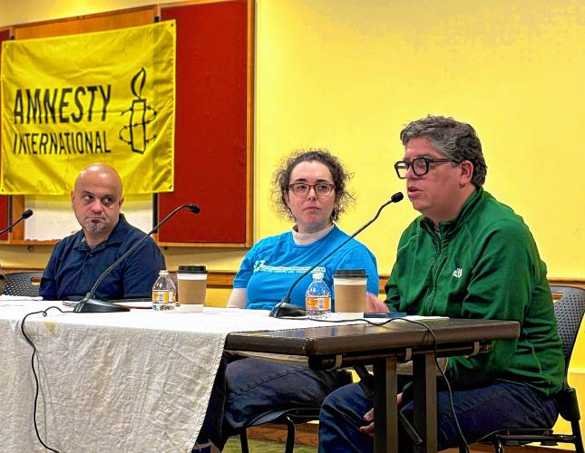 “I think it’s gonna be bad, even worse than Trump I,” said Javier Luengo-Garrido, right, a strategist for the American Civil Liberties Union of Massachusetts, discussing the president-elect’s promised crackdown on immigrants and immigration. He was joined by panelists Razvan Sibii and Ariana Keigan at Jones Library last week.