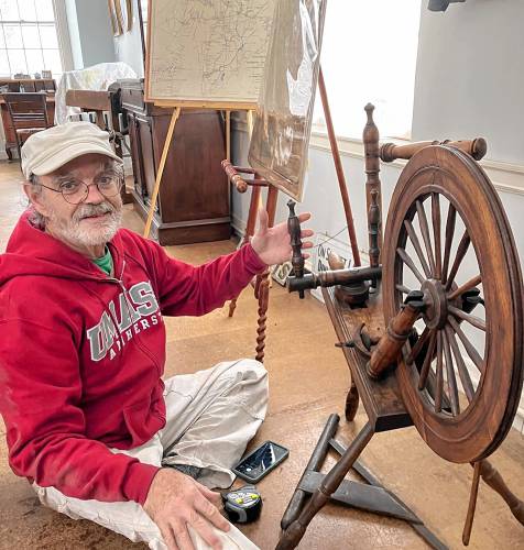 Joe Choiniere of Hubbardston with a flax wheel, said to have been owned by the Spooner family of Petersham in the late 1700s. Joe Choiniere of Hubbardston with a flax wheel, said to have been owned by the Spooner family of Petersham in the late 1700s.