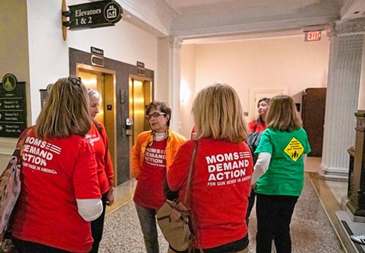 Members of Moms Demand Action stand outside the spectators' gallery during the ongoing Senate debate on a firearm reforms package on Thursday, Feb. 1. 