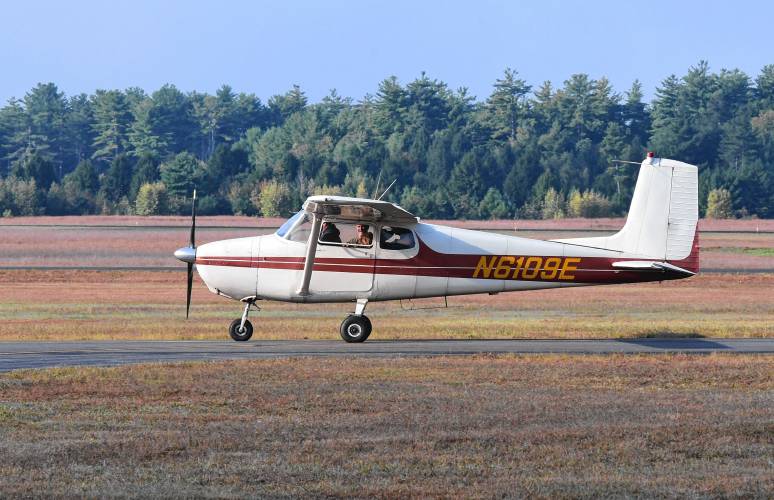 Tracking dogs and their handlers in a Cessna 172 owned and flown by pilot Chris Lucia at the Orange Airport on Monday. The event organized by the Northeast Houndsmen was to get the dogs used to the sounds and feel of flying in a small plane.