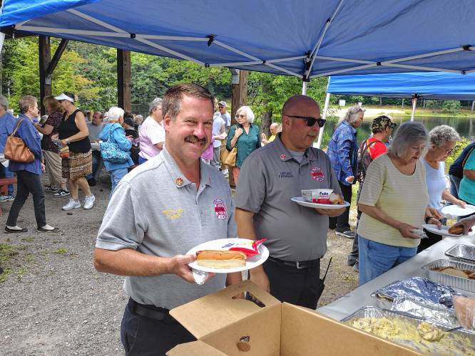 LEFT: Athol Deputy Fire Chief Jeff Parker (left) and Fire Capt. Eric Jack in line for lunch.