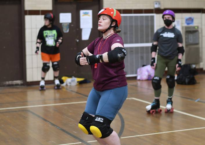 Caroline âBash-It Houndâ Moore of Northampton runs practice going over rules and techniques for participants of the Pioneer Valley Roller Derby at Franklin Countys YMCA in Greenfield. 