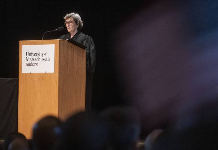 U.S. Magistrate Judge Katherine A. Robertson speaks during a naturalization ceremony at Bowker Auditorium, Tuesday, in Amherst.