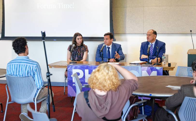 Julia Mathis, legislative aide for state Rep. Lindsay Sabadosa, from left, state Rep. Danillo Sena and state Sen. James Eldridge answer questions during a forum hosted by the Public Higher Education Network of Massachusetts and the UMass Amherst Student Government Association to discuss the Debt Free Future Act with legislators Tuesday at the UMass Amherst Student Union.