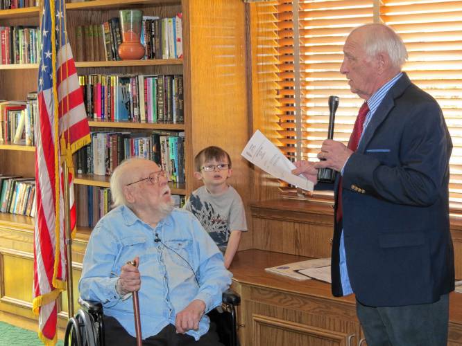 Thomas Gilgut Sr., 104, and great-grandson Jayce Sluder, 5, listen to Athol Selectboard member Anthony A. Brighenti speak as he presents Gilgut with the Boston Post cane as Athol’s most senior resident in November 2016. Brighetni died earlier this month.