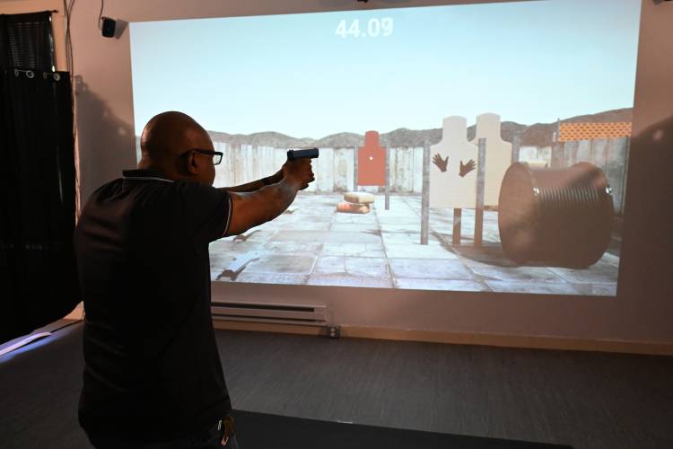 Leon “Lee” Laster, owner of the Western Massachusetts Training & Education Academy in Millers Falls, runs through a simulator at his business. Laster feels a clause in the new state gun reform law preventing 18- to 21-year-olds from carrying certain firearms will likely be overturned. “The question isn’t if it will get overturned [by the Supreme Judicial Court], the question is when it will get overturned,” he says.