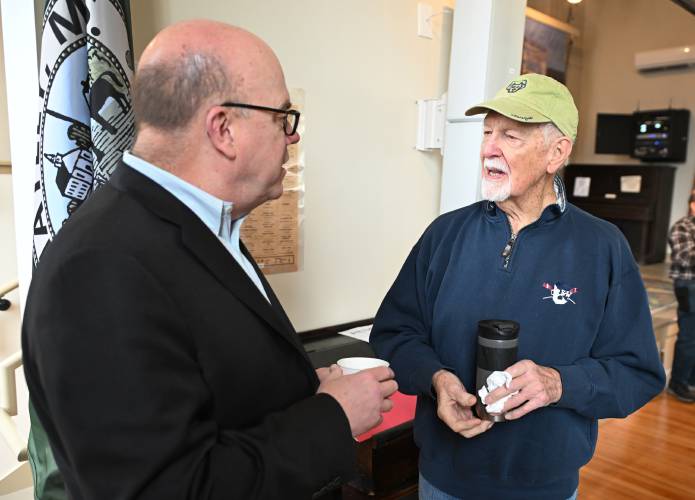 Conway resident Jim Moore, right, talks with Congressman Jim McGovern at Whately Town Hall on Wednesday.