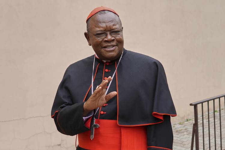 Cardinal Fridolin Ambongo Besungu arrives to celebrate Mass at his titular church, San Gabriele Arcangelo all'Acqua Traversa three days before the conclave to elect the 267th pope of the Roman Catholic Church, in Rome, Sunday, May 4, 2025. (AP Photo/Andrew Medichini)