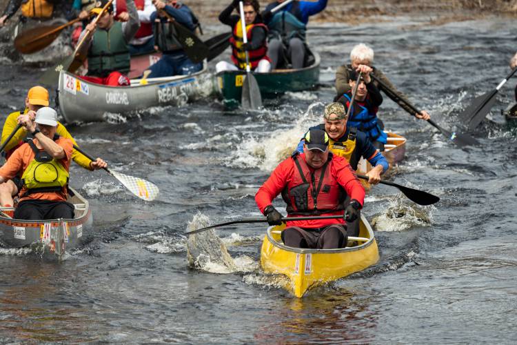 The 2024 River Rat Race saw nearly 180 canoers travel down a five-mile stretch of the Millers River from Athol into Orange.