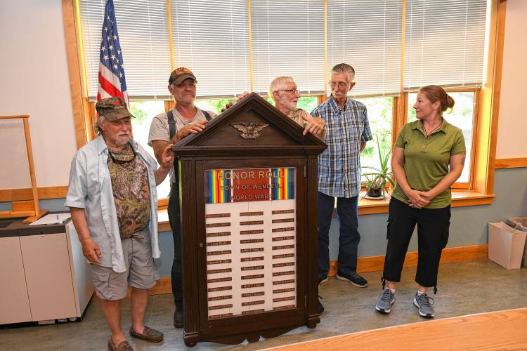 Wendell veterans with the town’s restored World War II memorial are Myron Becker, Doug Smith, Josh Heinemann and John Craddock, plus Stacey Geneczko, who is with the Upper Pioneer Valley Veterans Services District.