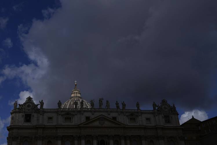 Clouds pass over the St. Peter's Basilica at the Vatican, Tuesday, May 6, 2025. (AP Photo/Gregorio Borgia)