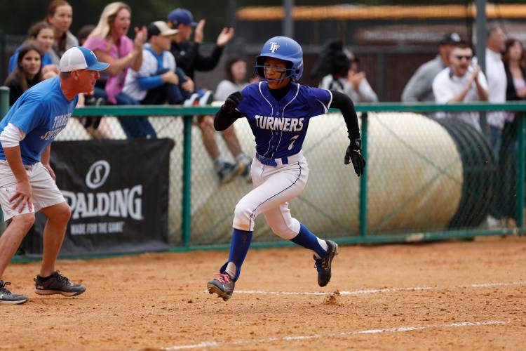 Turners Falls’ Marilyn Abarua (7) sprints down the third baseline to score against Greenfield during the MIAA Division 5 softball state championship Saturday at UMass.