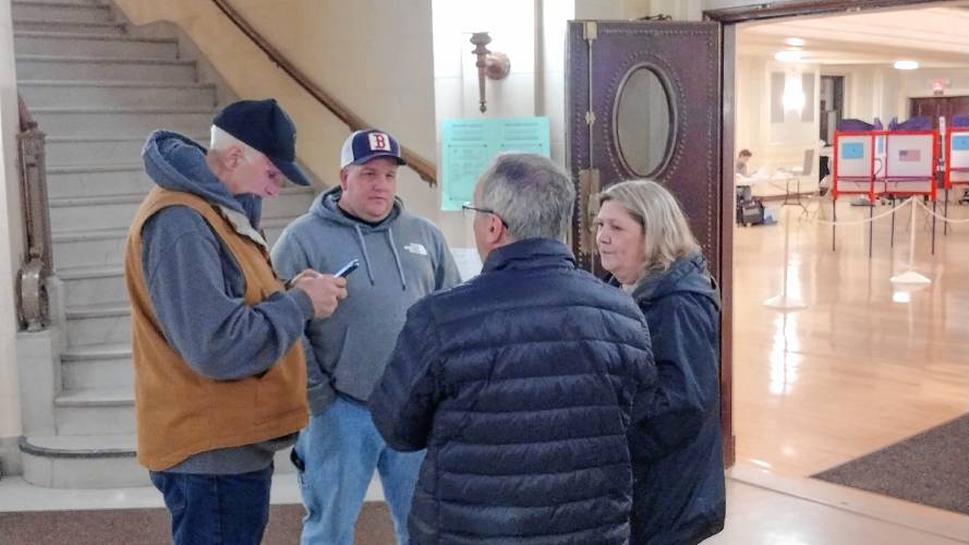 (From left) Athol Fire Chief Joseph Guarnera, Athol Firefighters Association President Travis Braley, Fire Department Staffing Advisory Committee Chair Ken Duffy, and Selectboard member Rebecca Bialecki discuss the Proposition 2 ½ override, which was approved by Athol voters at Monday’s Town Election.