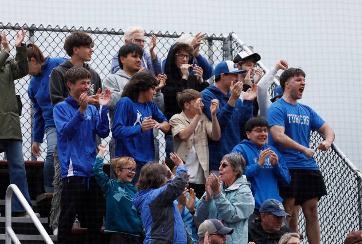 Turners Falls fans cheer after scoring against Greenfield during the MIAA Division 5 softball state championship Saturday at UMass.