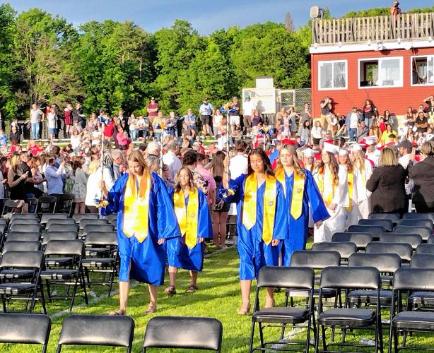 The Athol High School Class of 2024 walks to their seats for Friday’s graduation ceremony.