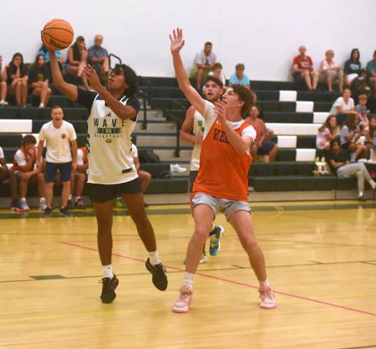 Greenfield's Krish Patel goes in for a layup against Keene on Wednesday in the boys varsity championship game of the DRIVE League at Greenfield High School. 